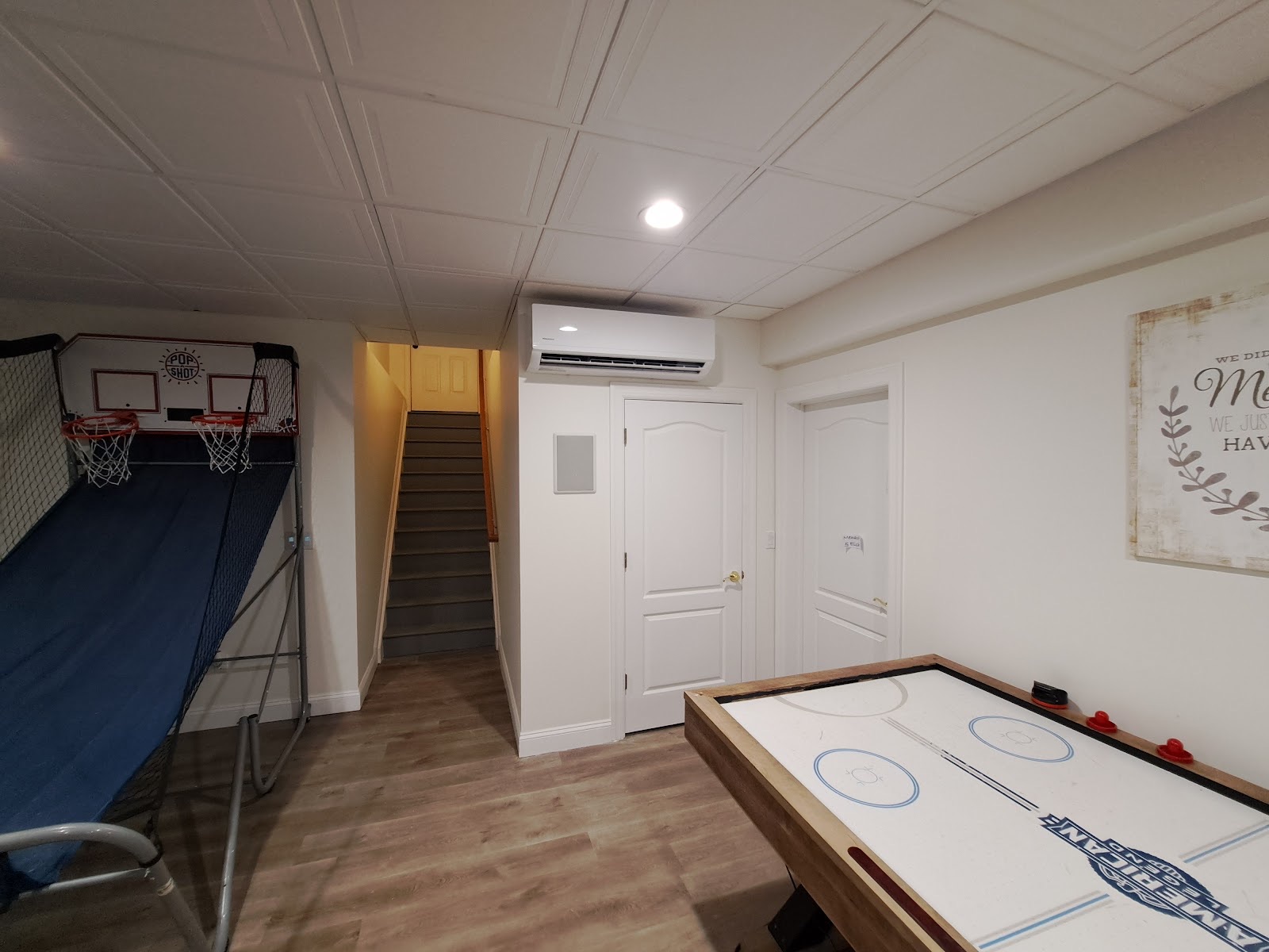 Ductless wall unit above a basement door